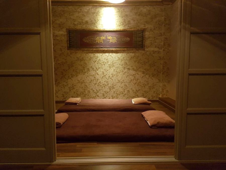Couple room seen through open doors, with two mats made up side by side